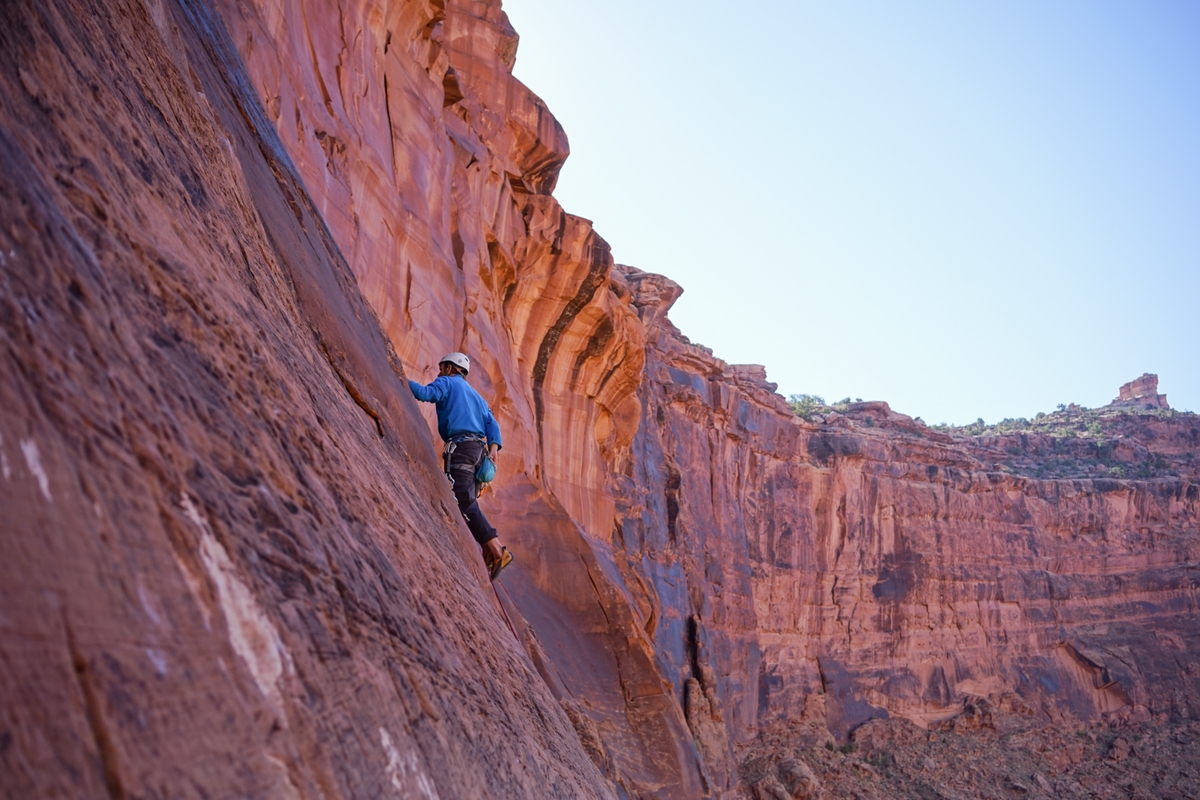 Scaling a rock formation.